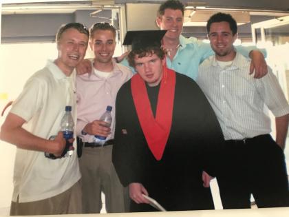 Mike McCarther poses for a photo at Stanley's high school graduation.