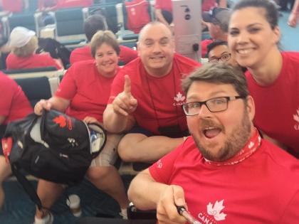 Cathy takes a group selfie with Team Canada athletes.