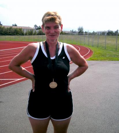 Patti poses for a photo at an athletics event.