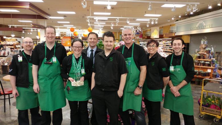 Ashley with her co-workers at Thrifty Foods