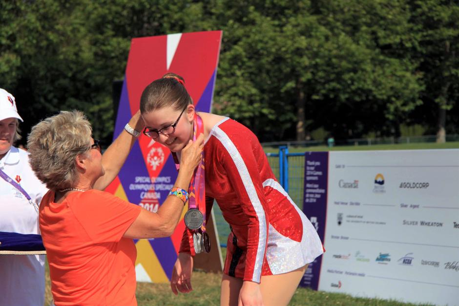 Annick Leger accepts a medal at the Special Olympics Canada Summer Games, Vancouver 2014.