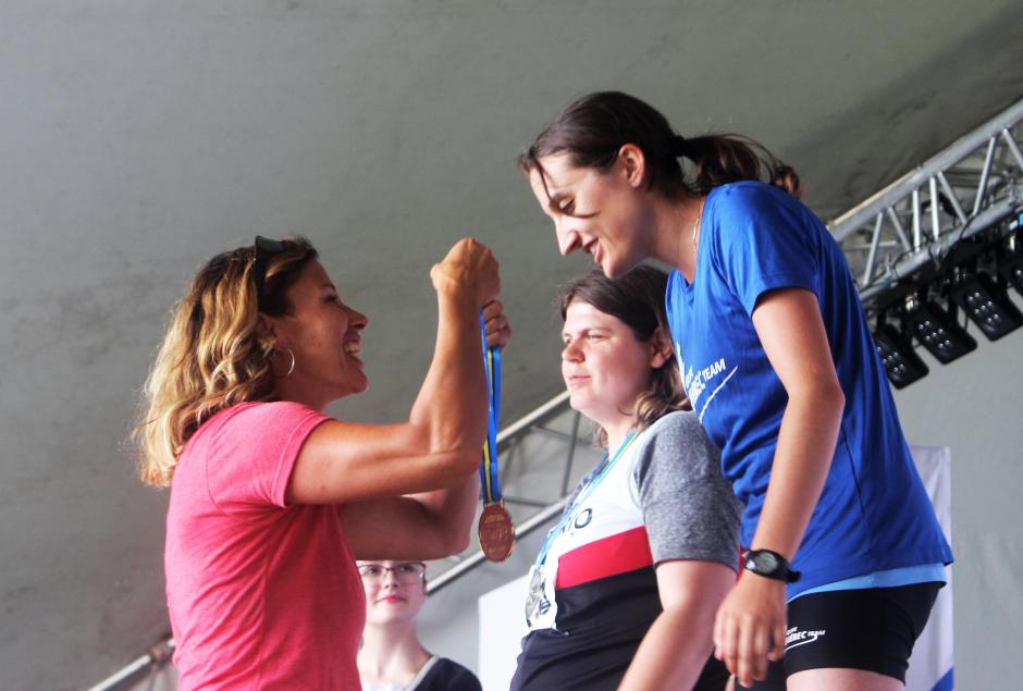 Olympic athlete Catriona Le May Doan places a medal on a Special Olympics athlete.