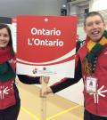 SOO's Juli Prokopchuk-Brattan and athlete Stephen Graham hold a sign that reads Ontario.