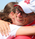 SO Team Canada 2019 golf coach Glenn Cundari hugs one of his athletes.