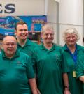 Maurice Bernier stands with his bowling team for a photo in front of the lanes.