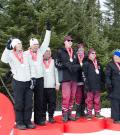 Athletes stand at podium