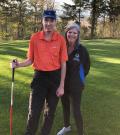 Jayne Burton and her son pose for a photo on a golf course