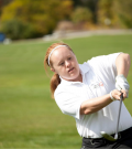 Special Olympics athlete Tess Trojan swings a golf club