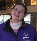 Athlete Bridget smiling at a curling practice