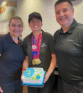 Marley Gayler poses with her managers at Tim Hortons, proudly wearing her Special Olympics medals. 