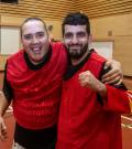 Two SOBC basketball players smiling and side-hugging