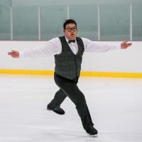 Special Olympics BC figure skater Alex Pang performs on the ice