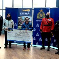 RCMP presents a cheque to Law Enforcement Torch Run for Special Olympics