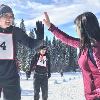 Special Olympics athlete and coach high-fiving