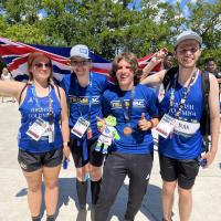 4 members of SOBC athletics team smiling