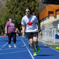 Jesse Thibeault running on track