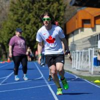 Jesse Thibeault running on track