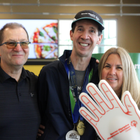 Special Olympics athlete Brent Shipton with Sobeys store owners, Dave and Deb Lukawenko.