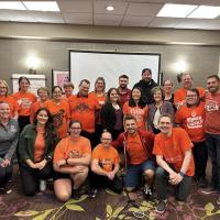 Canadian Athlete Input Council group photo, all wearing orange shirts