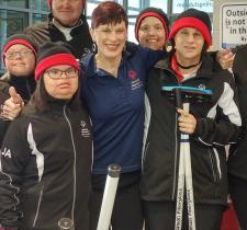 Marilyn smiling with group of SOBC athletes