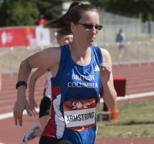 April Armstrong runs on the track.