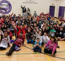 Special Olympics Ontario floor hockey team pose for group photo with middle school students who helped fund their trip to the Special Olympics Canada Winter Games Thunder Bay 2020.