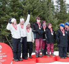 Athletes stand at podium