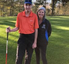 Jayne Burton and her son pose for a photo on a golf course