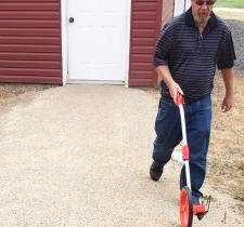 Bob measures a path at the school