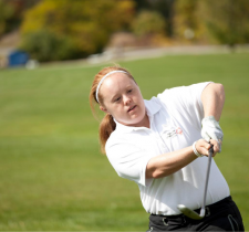 Special Olympics athlete Tess Trojan swings a golf club