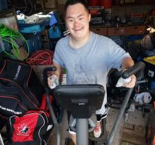 SOBC – Kamloops athlete Shinji Matthews makes his kilometres count on an elliptical machine.