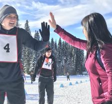 Special Olympics athlete and coach high-fiving