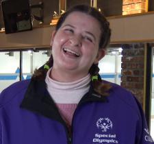 Athlete Bridget smiling at a curling practice