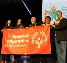 Prince George representatives with SOBC athlete and Jan Antons holding up SOBC banner