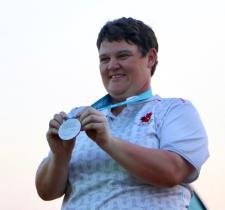 Erin Thom is all smiles as she receives her silver medal.