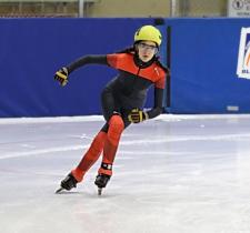 Hillary Birkett speed skating on the ice