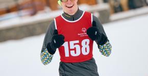 Torben smiling with thumbs up wearing his snowshoeing gear