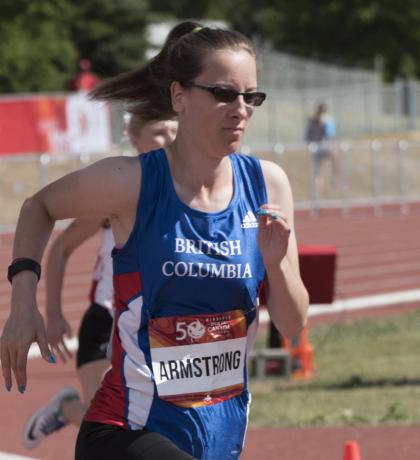 April Armstrong runs on the track.