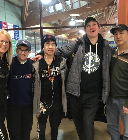 Speed skating athletes pose for a photo after a team building exercise.