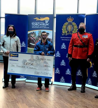 RCMP presents a cheque to Law Enforcement Torch Run for Special Olympics