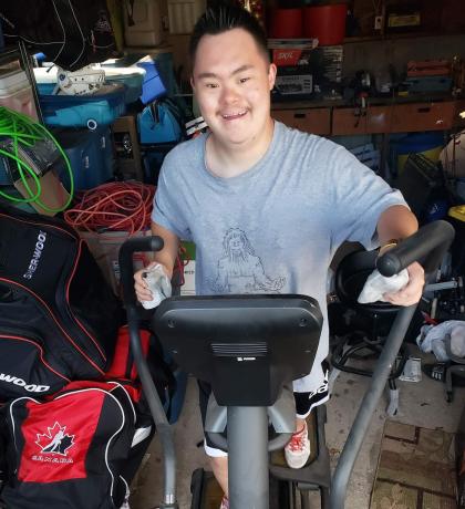 SOBC – Kamloops athlete Shinji Matthews makes his kilometres count on an elliptical machine.