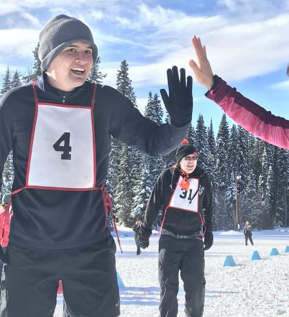 Special Olympics athlete and coach high-fiving