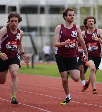 Athletes Jesse, Thomas, and Zak in a track race