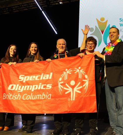 Prince George representatives with SOBC athlete and Jan Antons holding up SOBC banner