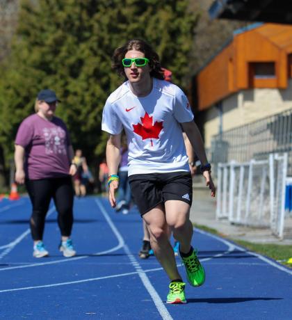 Jesse Thibeault running on track