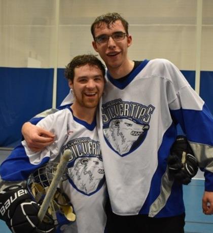 Joshua Trudell and floor hockey teammate