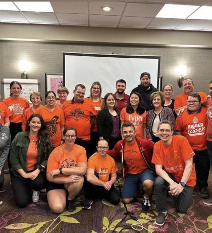 Canadian Athlete Input Council group photo, all wearing orange shirts
