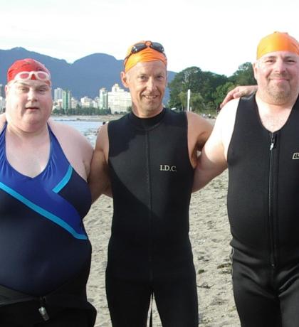 Peter with two other SOBC athletes, all in swimsuits at beach in Vancouver