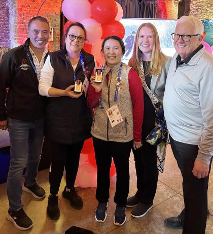 Special Olympics Directors and Dan Howe standing together
