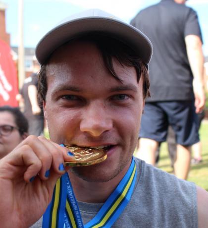 Kieran Corrigan taking a bite of gold